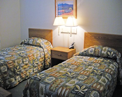Furnished bedroom with two twin beds.