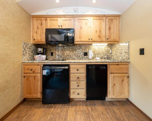 A well furnished bedroom alongside a bathroom.