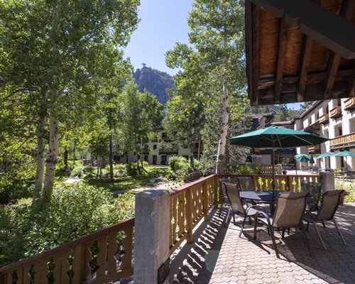 Scenic view of Olympic Village Inn resort with hammock.