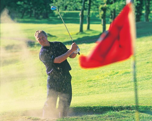 A golfer playing golf at the golf course.