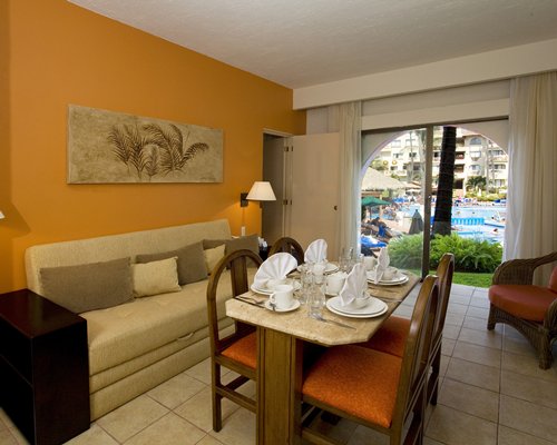 A well furnished bedroom with television.