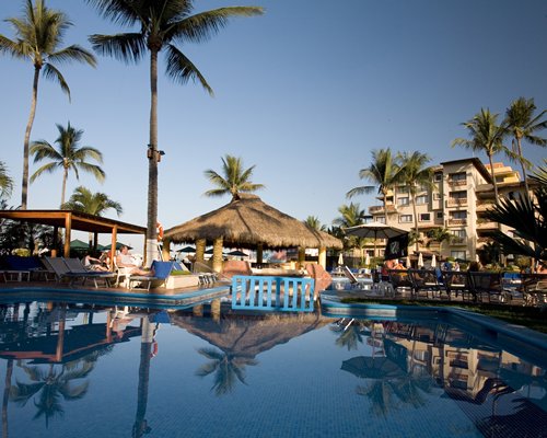 Reception and lounge area at Canto del Sol Plaza Vallarta with multiple indoor balconies.