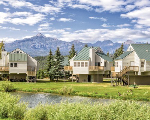 VIEW OF THE WYNDHAM PAGOSA RESORT WITH A WATERFRONT AND LANDSCAPING.