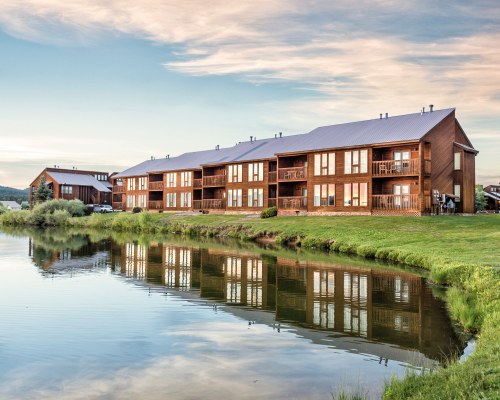A SCENIC EXTERIOR VIEW OF WYNDHAM PAGOSA RESORT ALONGSIDE THE WATERFRONT.