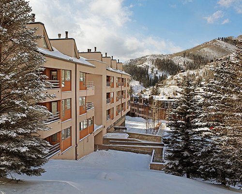 Exterior view of the Streamside At Vail Douglas covered in snow.