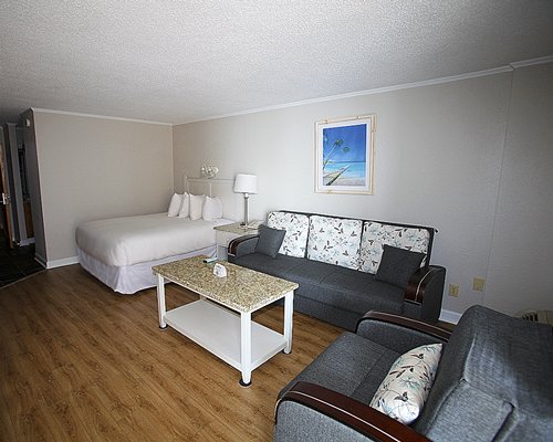 A well furnished living room with a dining area.