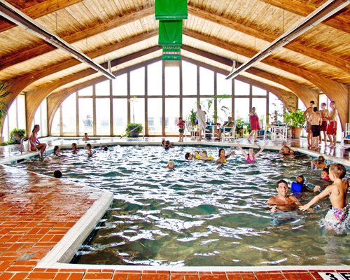 View of people at an indoor swimming pool.