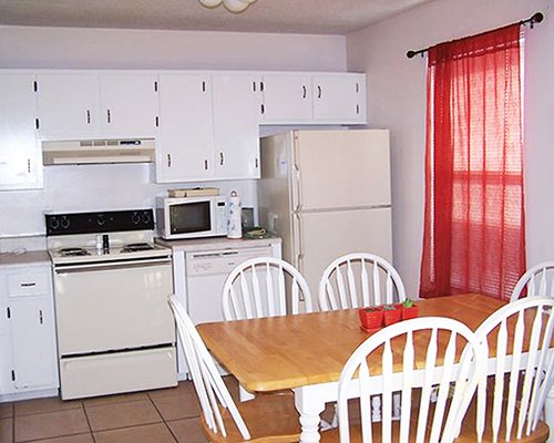 A well equipped kitchen with a dining area.