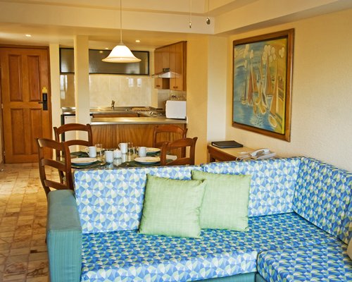 Living room with an open plan kitchen and dining area.