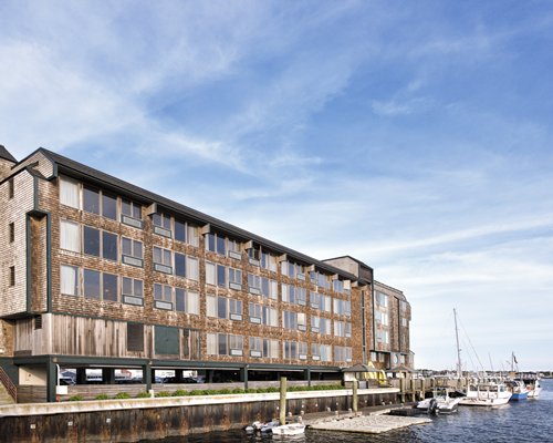 Exterior view of the Wyndham Inn on Long Wharf alongside the water with marina.