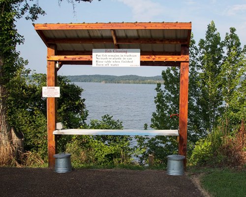 A view of outdoor fish cleaning table alongside the lake.