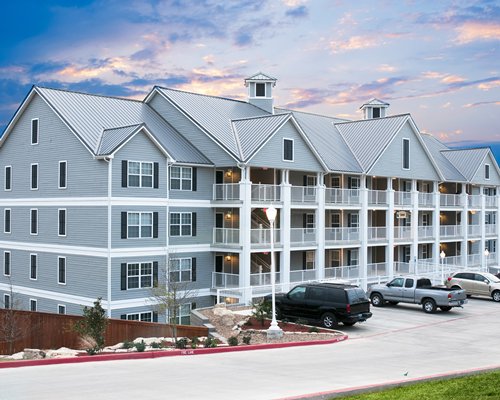 An exterior view of Holiday Inn Club Vacations Hill Country Resort surrounded by wooded area.