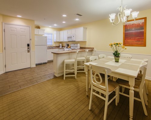 An open plan living room kitchen and dining area.