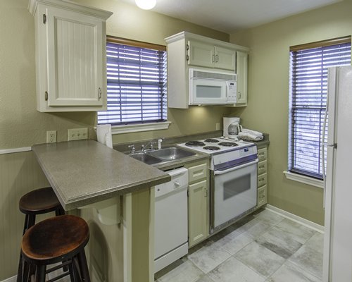 An open plan kitchen with counter seating.