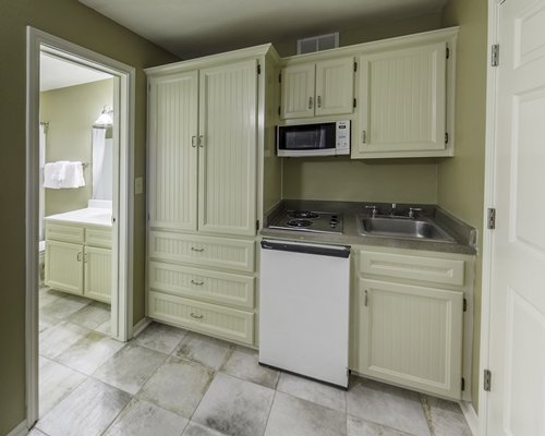 Kitchenette and door into bathroom.