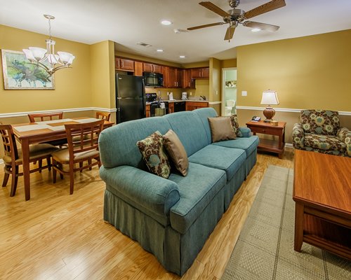 An open plan living room with dining and kitchen area.