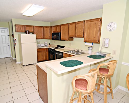 A well equipped kitchen with breakfast bar.