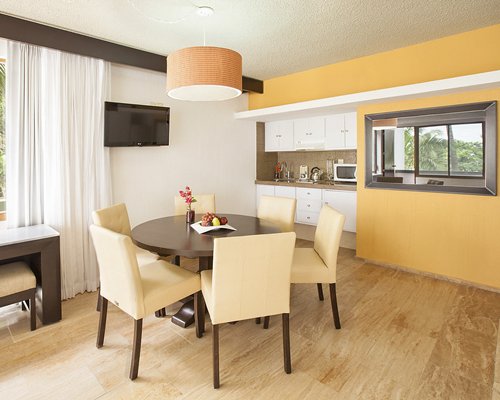 A well furnished bedroom with two twin beds hot tub and balcony.