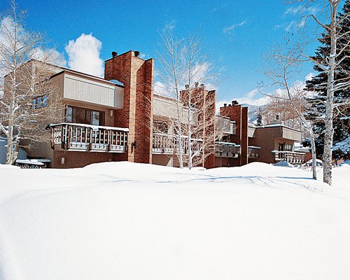 An exterior view of the Shadow Mountain Lodge at Aspen resort surrounded by snow.