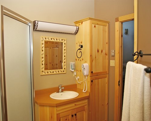 A bathroom with single sink vanity.
