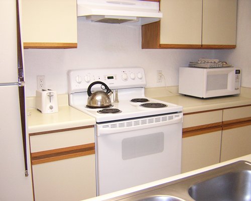 A well equipped kitchen with microwave oven.
