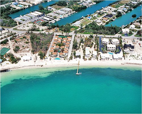 An aerial view of resort property alongside the beach.