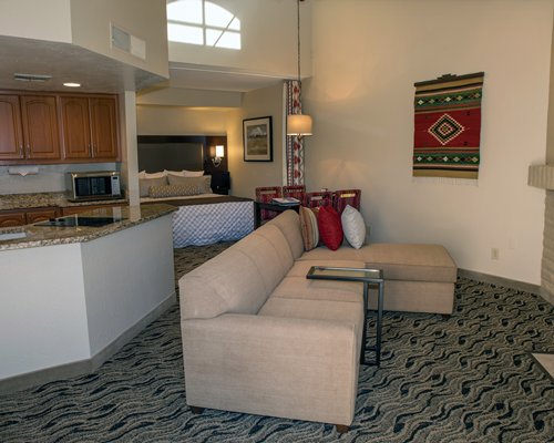An open plan living room with television and dining area.