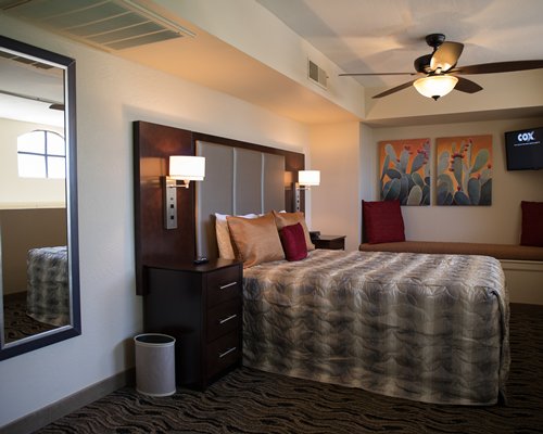 A well furnished bedroom with two twin beds.