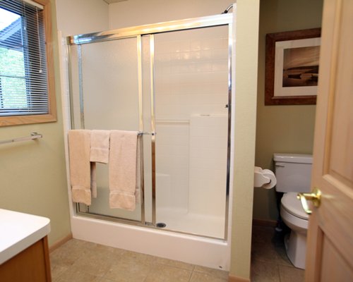 A bathroom with a shower stall.