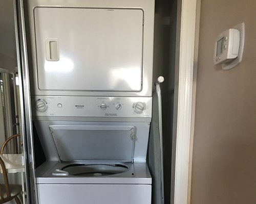 A room with a washing machine.