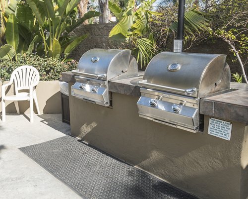 An outdoor barbecue grills.