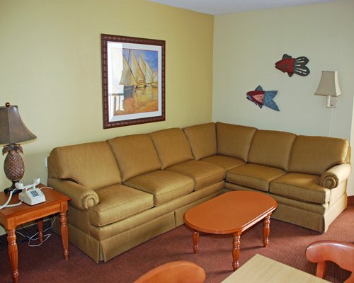 A well furnished living room with a queen pull out sofa.