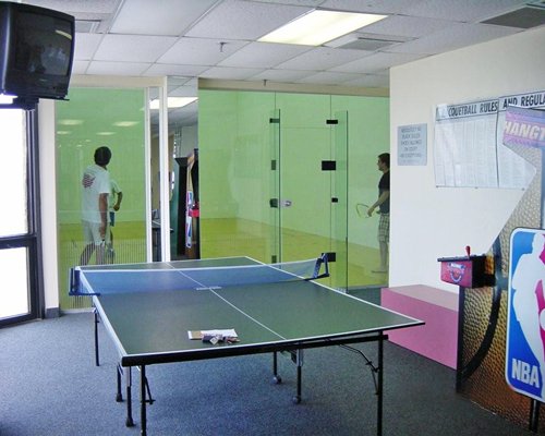 Indoor recreation area with ping pong arcade game and squash.