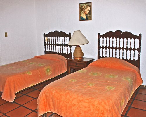 A well furnished bedroom with two beds.