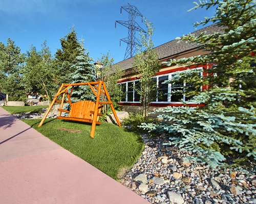 Picnic area with a swing alongside a unit.