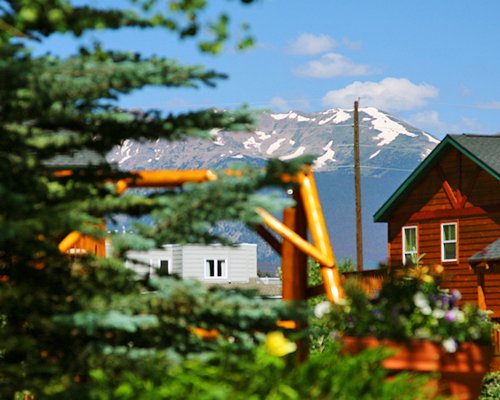 Scenic exterior view of the units at Swan Mountain Resort alongside the mountains.