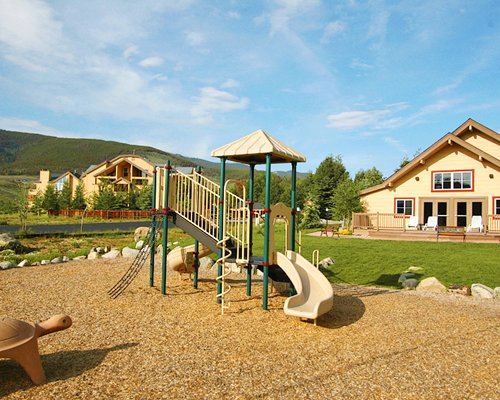 An outdoor playscape area alongside the resort units.