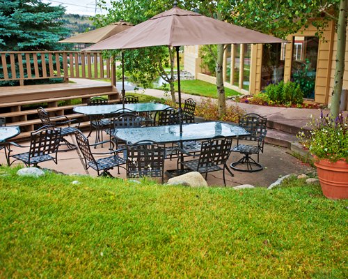 An outdoor dining area with sunshades.