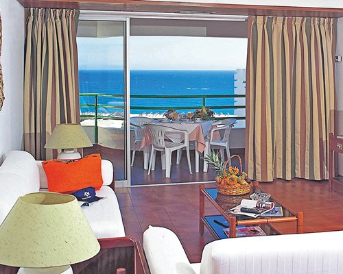 A well furnished living room with the beach view.