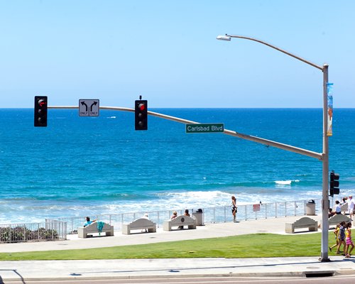 Street view of the beach with traffic signal.