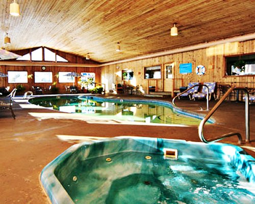 An indoor swimming pool and hot tub.