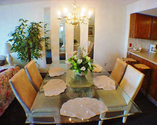 A well furnished dining room with a breakfast bar.