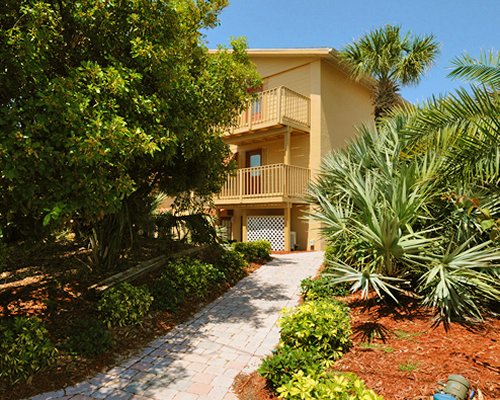 A scenic pathway leading to the Ocean Beach Club At New Smyrna Waves Resort.