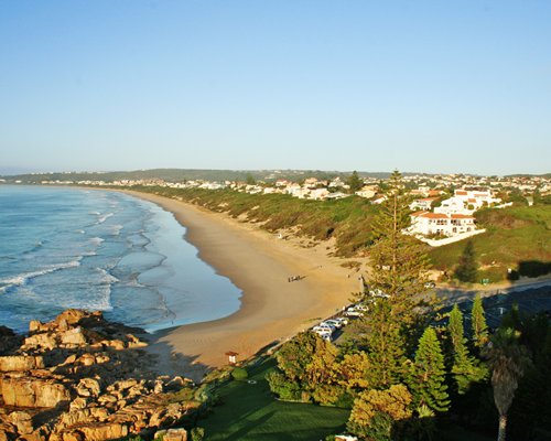 An aerial view of Beacon Island Hotel alongside the ocean.