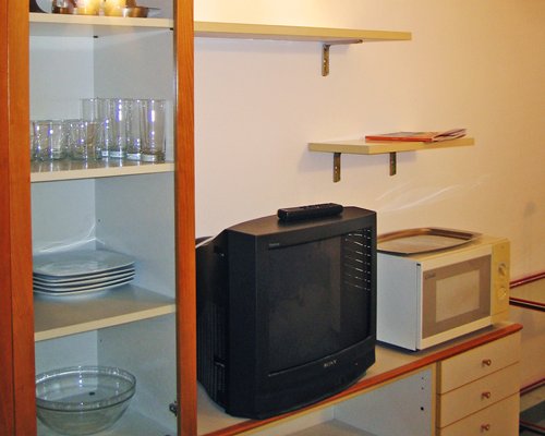 A view of the wooden table with television.
