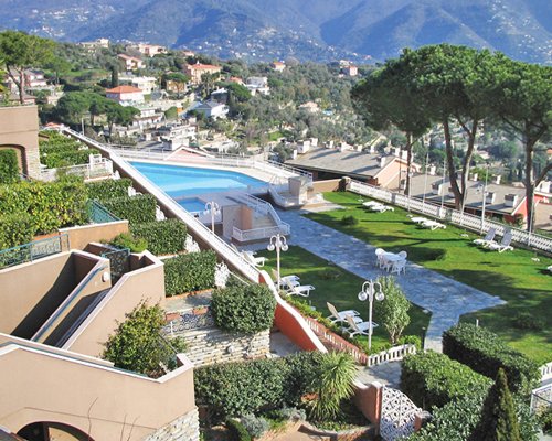 Scenic pathway to multiple units at Portofino Est Residence with outdoor swimming pool.