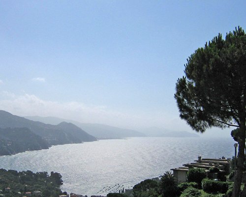 Scenic view of the beach alongside a mountain.