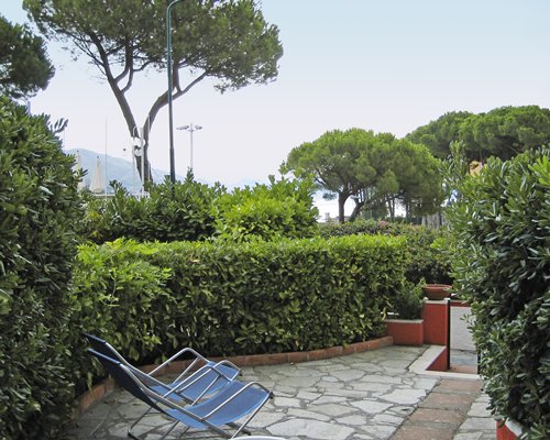 Outdoor lounge area with chaise lounge chairs.