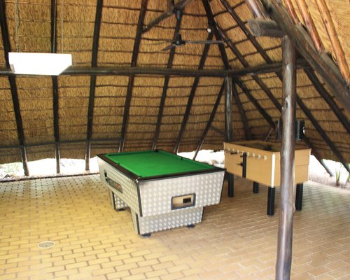 Recreation area with foosball and pool table.