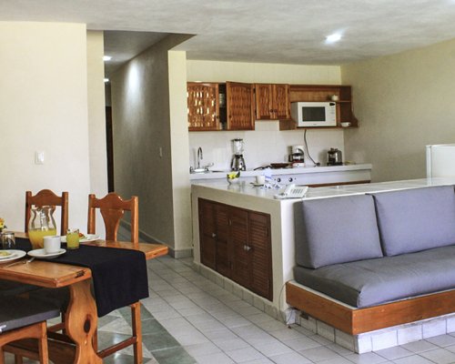 An open plan living and dining area alongside a kitchen.